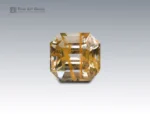 Natural 47 carat rutile-included quartz emerald cut gemstone from Pakistan, golden needle inclusions ideal for collectors or custom jewelry
