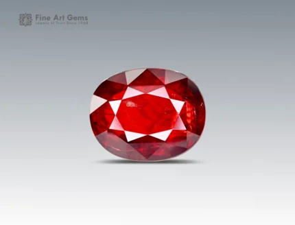 14.4 carat vivid red tantalite gemstone in oval cut from Afghanistan, faceted gem displayed on neutral background