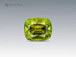 3.7 carat greenish-yellow tourmaline gemstone in cushion cut from Afghanistan, faceted gem on neutral background