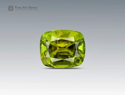 3.7 carat greenish-yellow tourmaline gemstone in cushion cut from Afghanistan, faceted gem on neutral background