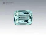 4.25 carat aquamarine gemstone in cushion cut from Madagascar, light blue faceted gem on neutral background