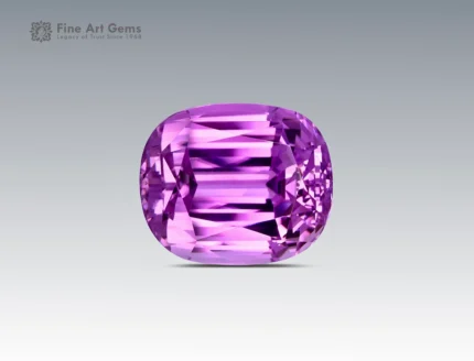 98.3 carat kunzite gemstone in cushion cut from Afghanistan, vibrant pinkish-purple faceted gem on neutral background