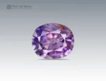 1.7 carat sapphire gemstone with oval cut from Nigeria, showing purple hues with natural inclusions, ideal for jewelry and collections