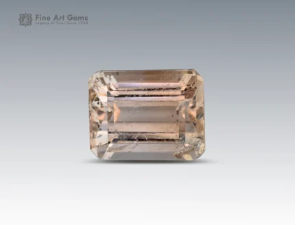 11 carat champagne topaz gemstone in emerald cut from Pakistan, rectangular faceted gem with natural inclusions on a neutral background