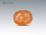 16 carat orange topaz gemstone in oval cut from Pakistan, faceted gem with natural inclusions on neutral background