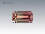.1 carat Afghan tourmaline gemstone with emerald cut and soft pink-brown tones.