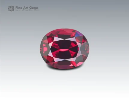 2.5 carat oval-cut rhodolite garnet with deep raspberry-red color from Africa.