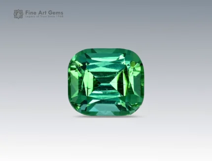 2.7 carat green tourmaline gemstone in cushion cut from Afghanistan, vibrant faceted gem on neutral background