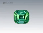 2.7 carat green tourmaline gemstone in cushion cut from Afghanistan, vibrant faceted gem on neutral background