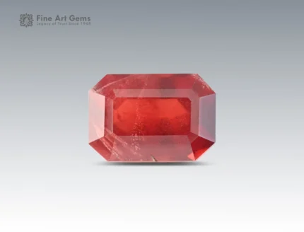 3.85 carat rhodolite garnet in emerald cut from Africa, deep red gemstone displayed on neutral background