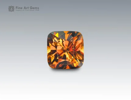 4.7 carat sphene (titanite) gemstone from Pakistan with cushion cut, golden-orange brilliance and strong fire.