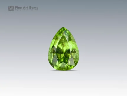 5.25 carat peridot gemstone with ludwigite inclusions and pear cut from Pakistan, ideal for jewelry rings, pendants, and collections