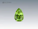 5.25 carat peridot gemstone with ludwigite inclusions and pear cut from Pakistan, ideal for jewelry rings, pendants, and collections