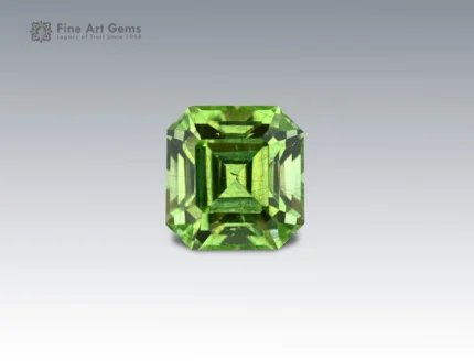 5.35 carat Pakistani peridot with Asscher cut, featuring fine ludwigite inclusions.