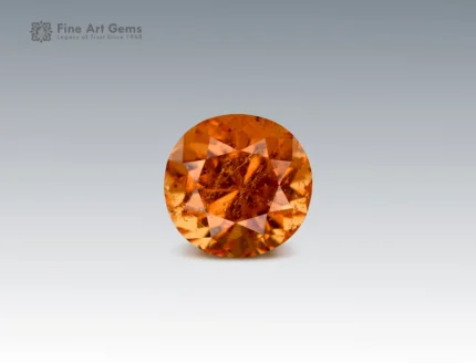 ound cut 50 cent clinohumite gemstone in vivid orange hue from Tajikistan