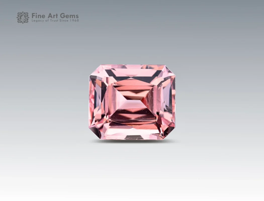 6.15 carat pink morganite gemstone in scissors cut from Nigeria, faceted rectangular gem on neutral background