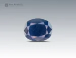 8 carat oval cut sapphire gemstone from Madagascar, deep blue faceted gem on neutral background