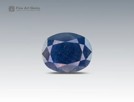 8 carat oval cut sapphire gemstone from Madagascar, deep blue faceted gem on neutral background