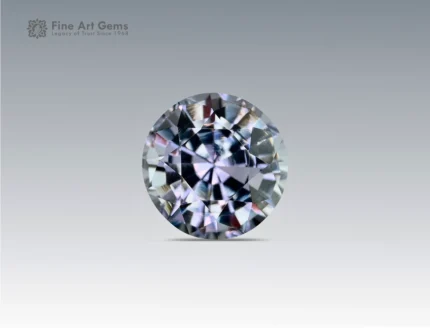 A 0.9 carat round-cut Parti Sapphire from Nigeria with sparkling blue and violet tones, ideal for jewelry.