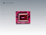 A 1.75 carat baguette-cut Rhodolite Garnet from Africa with vivid raspberry-red color, ideal for jewelry.
