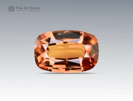 A 1.1 carat oval-cut Parti Sapphire from Nigeria showing rich golden-orange tones, perfect for rings or pendants.