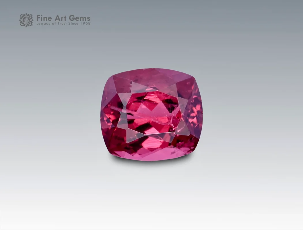 Vivid 1.1 carat rhodolite garnet in cushion cut, sourced from Africa, displaying radiant raspberry-pink hues with fine brilliance and clarity.