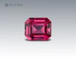A 1.35 carat emerald-cut Rhodolite Garnet from Africa with rich raspberry-red color, ideal for fine jewelry.