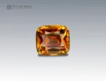 A 1.75 carat cushion-cut Sphene (Titanite) from Pakistan showing fiery golden-orange brilliance, ideal for fine jewelry.