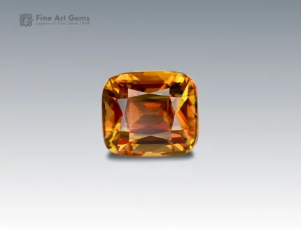 A 1.75 carat cushion-cut Sphene (Titanite) from Pakistan showing fiery golden-orange brilliance, ideal for fine jewelry.