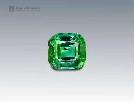 A 2.65 carat cushion-cut green Tourmaline from Afghanistan with vivid color and brilliance, perfect for fine jewelry.