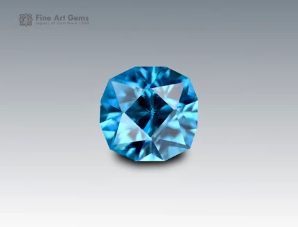 Natural 2.9 carat fancy cushion cut blue zircon gemstone from Cambodia with vivid brilliance, fine clarity, and unique faceting.