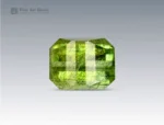 Brilliant 6 carat peridot gemstone from Pakistan featuring unique Ludwigite inclusions and a precise pixel cut, glowing with vibrant green tones.