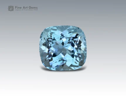 Brilliant 6.7 carat aquamarine gemstone with cushion cut, showcasing vivid ocean-blue color and fine clarity, sourced from Madagascar.