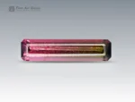 7.15 carat emerald cut tourmaline gemstone from Afghanistan with striking pink and green bi-color zoning, exceptional clarity, and brilliance.