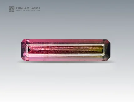 7.15 carat emerald cut tourmaline gemstone from Afghanistan with striking pink and green bi-color zoning, exceptional clarity, and brilliance.