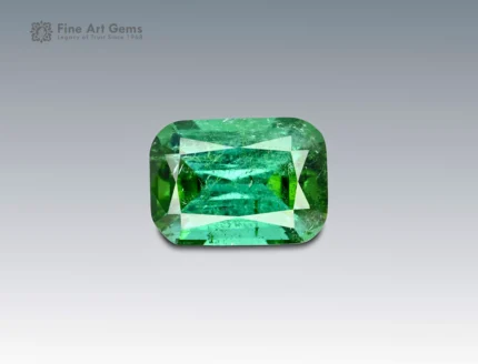 A 7.65 carat cushion-cut green tourmaline from Afghanistan with vivid color and brilliance, ideal for fine jewelry.