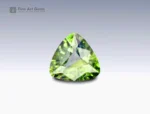 Trilliant-cut parti sapphire gemstone weighing 0.95 carats from Nigeria, displaying a mix of green and yellow hues with fine brilliance.