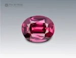 Brilliant 1.7 carat oval cut rhodolite garnet with vivid pinkish-red hue, sourced from Africa. Ideal for fine jewelry and gemstone collections.
