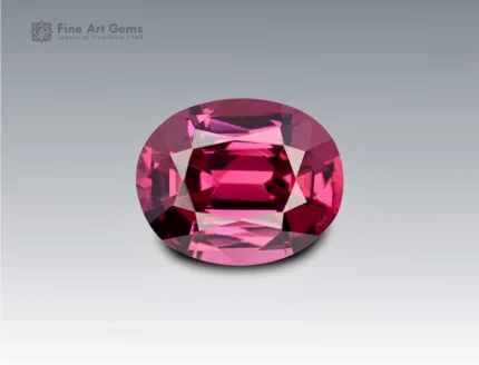 Brilliant 1.7 carat oval cut rhodolite garnet with vivid pinkish-red hue, sourced from Africa. Ideal for fine jewelry and gemstone collections.