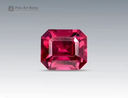 Emerald-cut deep purplish-pink rhodolite garnet weighing 1.70 carats from Africa, with vibrant saturation and fine clarity.