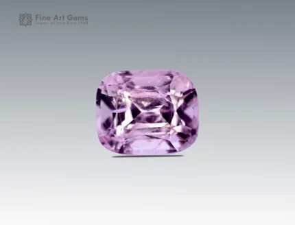 Cushion-cut pastel pink topaz gemstone weighing 1.85 carats from Pakistan, with soft color and brilliant clarity.