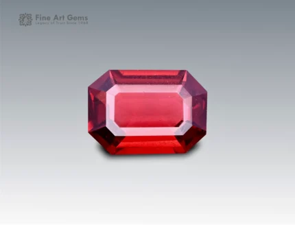 Natural 1.85 carat emerald cut rhodolite garnet with deep red-pink brilliance, sourced from Africa. Perfect for fine jewelry and collectors.
