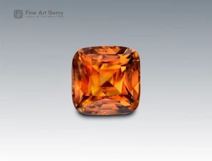 Brilliant 1.9 carat cushion cut sphene (titanite) gemstone from Pakistan with fiery golden-orange brilliance and exceptional dispersion.