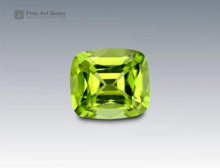 Brilliant 2.1 carat cushion cut peridot gemstone in vivid lime-green, ethically sourced from Pakistan. Ideal for custom jewelry and gemstone collectors.
