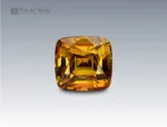 Natural 3 carat cushion cut sphene (titanite) gemstone from Pakistan with golden-green brilliance and exceptional fire. Rare and collectible.
