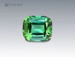Cushion-cut green tourmaline gemstone weighing 3.10 carats from Afghanistan, with rich saturation and fine brilliance.