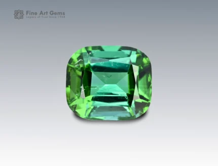 Cushion-cut green tourmaline gemstone weighing 3.10 carats from Afghanistan, with rich saturation and fine brilliance.