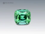 Cushion-cut green tourmaline gemstone weighing 3.25 carats from Afghanistan, displaying vivid saturation and fine clarity.