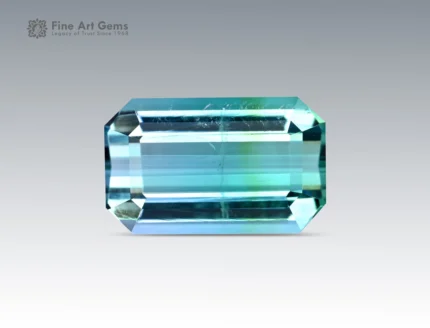 Emerald-cut blue-green tourmaline gemstone weighing 4.65 carats from Afghanistan, displaying sharp clarity and vibrant color.