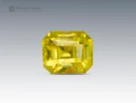 0.15 carat emerald-cut yellow stibiotantalite gemstone from Afghanistan.